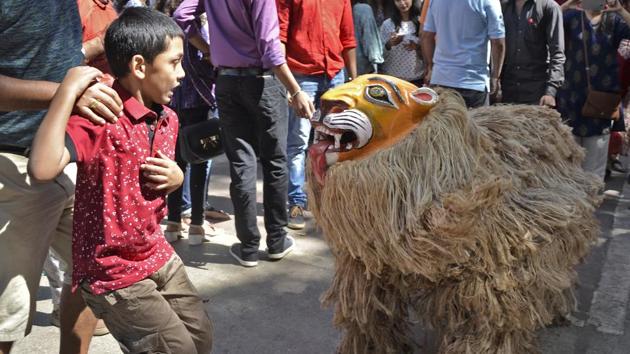 A boy reacts to a man in a lion’s costume. There was a whole range of workshops for children, to both educate and entertain. Children as young as two could participate in as many as 43 sessions. (Ragul Krishnan / HT Photo) A boy reacts to a man in a lion’s costume. There was a whole range of workshops for children, to both educate and entertain. Children as young as two could participate in as many as 43 sessions. (Ragul Krishnan / HT Photo)
