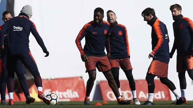 FC Barcelona's Lionel Messi, second right, takes part during a training session with his teammates on Saturday. (AP) FC Barcelona's Lionel Messi, second right, takes part during a training session with his teammates on Saturday. (AP)