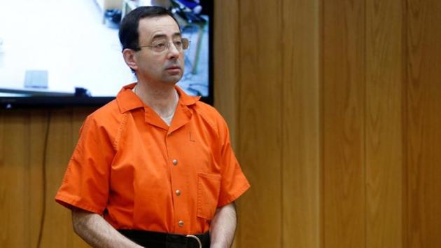 Larry Nassar, a former team USA Gymnastics doctor who pleaded guilty in November 2017 to sexual assault charges, stands in court during his sentencing hearing in the Eaton County Court in Charlotte. (Reuters) Larry Nassar, a former team USA Gymnastics doctor who pleaded guilty in November 2017 to sexual assault charges, stands in court during his sentencing hearing in the Eaton County Court in Charlotte. (Reuters)