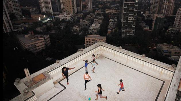 One has to watch how hard one kicks the ball, when there’s a chance it could plummet several storeys. But the terrace and building lobby are often the only places available for play in overcrowded Mumbai. (Hemanshi Kamani / HT Photo) One has to watch how hard one kicks the ball, when there’s a chance it could plummet several storeys. But the terrace and building lobby are often the only places available for play in overcrowded Mumbai. (Hemanshi Kamani / HT Photo)