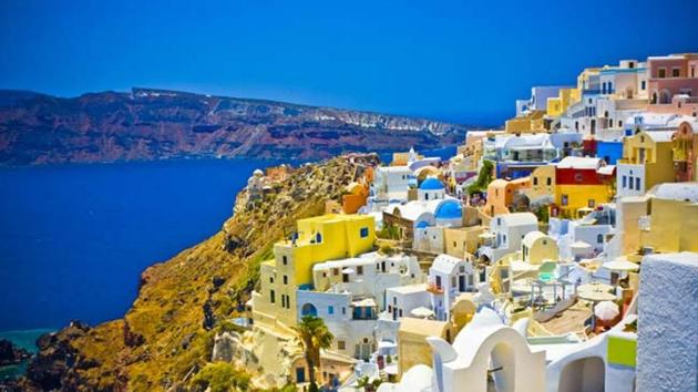 Santorini in Greece is known for its electric blue skies, white-coloured houses, and the dark blue ocean. (Shutterstock) Santorini in Greece is known for its electric blue skies, white-coloured houses, and the dark blue ocean. (Shutterstock)