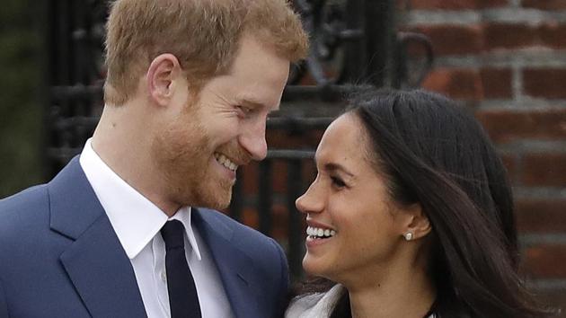 Britain's Prince Harry and his fiancee Meghan Markle pose for photographers in the grounds of Kensington Palace in London, following the announcement of their engagement. (AP)