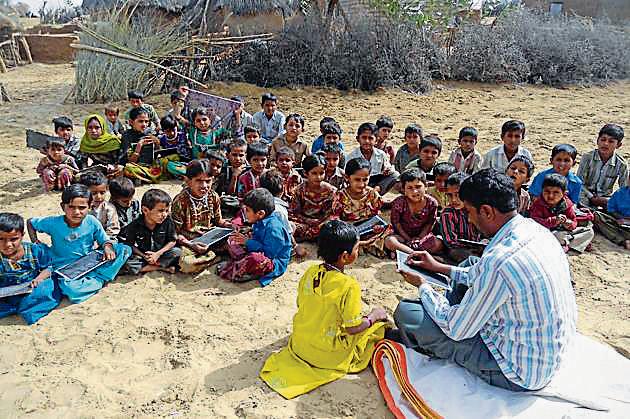 Children study in the open at a school in Barmer district. The recent report of Pratham, an NGO working in the education sector, states that the learning levels of students in areas, such as arithmetic and basic reading, are low. (HT File Photo) Children study in the open at a school in Barmer district. The recent report of Pratham, an NGO working in the education sector, states that the learning levels of students in areas, such as arithmetic and basic reading, are low. (HT File Photo)