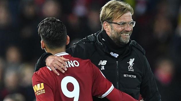 Liverpool manager Jurgen Klopp hugs Roberto Firmino after their match against Southampton on Sunday. (AFP) Liverpool manager Jurgen Klopp hugs Roberto Firmino after their match against Southampton on Sunday. (AFP)