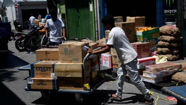 A Maldives labourers pushes a cart loaded with goods outside a market in Male on February 8, 2018. (AFP File Photo) A Maldives labourers pushes a cart loaded with goods outside a market in Male on February 8, 2018. (AFP File Photo)