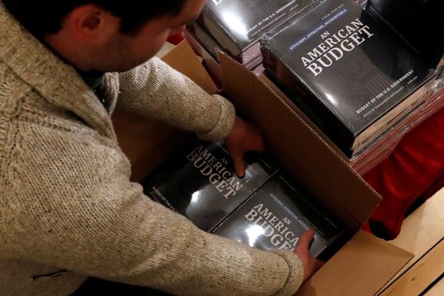 Copies of US President Donald Trump's 2019 budget proposal are delivered to the House Budget Committee offices on Capitol Hill in Washington on February 12, 2018. (Reuters) Copies of US President Donald Trump's 2019 budget proposal are delivered to the House Budget Committee offices on Capitol Hill in Washington on February 12, 2018. (Reuters)
