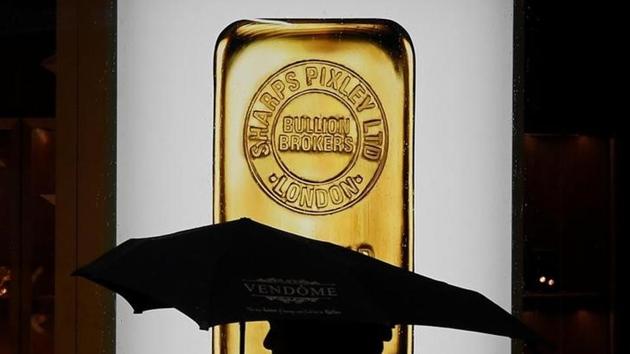 A pedestrian walks past a window displaying a representation of a gold bar at a bullion broker in Piccadilly, London. (Reuters) A pedestrian walks past a window displaying a representation of a gold bar at a bullion broker in Piccadilly, London. (Reuters)