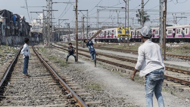 For kids who don’t have access to even building open areas and community playgrounds, the only place for a game of cricket is the railway tracks, as is the case largely in Mumbai. (Satish Bate / HT Photo) 
