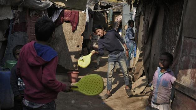 Delhi has more green spaces, if one’s from a certain socio-economic class. “There is only one large ground in our area and kids from miles come to play there. I don’t let my son go; it’s a hazard,” says Sushma Dahiya, a resident of Mundka (not pictured here). In the slums, there isn’t even that. So here kids play a game that doesn’t exist – with table tennis paddles and a shuttlecock – in the narrow lanes of Jamia Nagar. (Burhaan Kinu / HT Photo) Delhi has more green spaces, if one’s from a certain socio-economic class. “There is only one large ground in our area and kids from miles come to play there. I don’t let my son go; it’s a hazard,” says Sushma Dahiya, a resident of Mundka (not pictured here). In the slums, there isn’t even that. So here kids play a game that doesn’t exist – with table tennis paddles and a shuttlecock – in the narrow lanes of Jamia Nagar. (Burhaan Kinu / HT Photo)