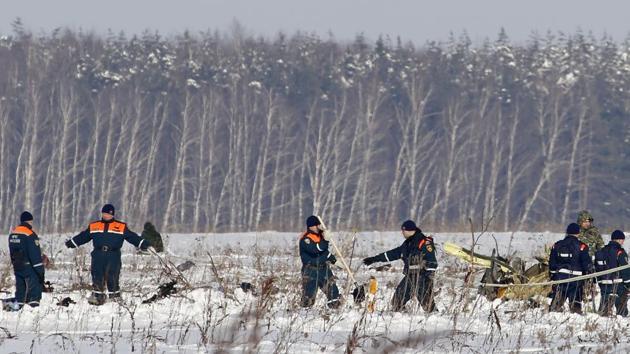 Personnel work the scene of a AN-148 plane crash in Stepanovskoye village, about 40 kilometers from the Domodedovo airport, Russia on February 12, 2018. A Russian passenger plane en route Orsk and carrying 71 people crashed near Moscow, killing everyone aboard shortly after take-off. (Alexander Zemlichenko / AP) Personnel work the scene of a AN-148 plane crash in Stepanovskoye village, about 40 kilometers from the Domodedovo airport, Russia on February 12, 2018. A Russian passenger plane en route Orsk and carrying 71 people crashed near Moscow, killing everyone aboard shortly after take-off. (Alexander Zemlichenko / AP)