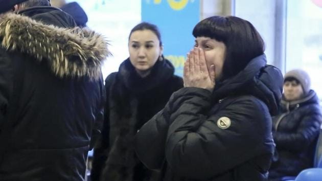 Relatives and friends of those on the Saratov Airlines An-148 flight react while gathering at an airport outside Orsk, Russia on Sunday. A Swiss citizen and a citizen of Azerbaijan were among the fatalities on a list released by the emergency services ministry. Three children also died including a five-year-old girl. (Orsk.ru via / AP) Relatives and friends of those on the Saratov Airlines An-148 flight react while gathering at an airport outside Orsk, Russia on Sunday. A Swiss citizen and a citizen of Azerbaijan were among the fatalities on a list released by the emergency services ministry. Three children also died including a five-year-old girl. (Orsk.ru via / AP)
