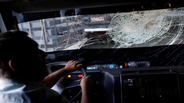 Andres Pernia drives his truck with a broken windshield. Across Venezuela, there were some 162 lootings in January, including 42 of trucks, according to Oswaldo Ramirez Consultores (ORC) a consultancy which tracks road safety. That compared to eight lootings, including one truck robbery, in the same month of last year. Eight people have died in the lootings this year, according to a Reuters tally. (Carlos Garcia Rawlins / REUTERS) Andres Pernia drives his truck with a broken windshield. Across Venezuela, there were some 162 lootings in January, including 42 of trucks, according to Oswaldo Ramirez Consultores (ORC) a consultancy which tracks road safety. That compared to eight lootings, including one truck robbery, in the same month of last year. Eight people have died in the lootings this year, according to a Reuters tally. (Carlos Garcia Rawlins / REUTERS)