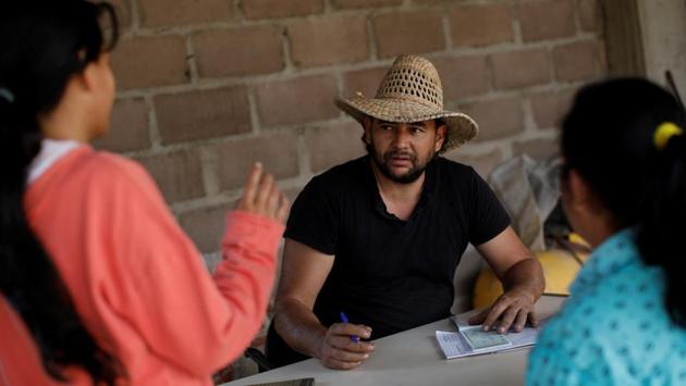 Yone Escalante (C), shudders when he recalls being ransacked. When one of his trucks broke down, about 60 people appeared from the shadows to surround it. Soon the crowd had swelled to 300, chanting menacingly “Food for the people!” “They came at us like ants and stripped us of everything. It took me all day to load that truck, and 30 minutes for them to empty it. I could cry with rage.” (Carlos Garcia Rawlins / REUTERS) Yone Escalante (C), shudders when he recalls being ransacked. When one of his trucks broke down, about 60 people appeared from the shadows to surround it. Soon the crowd had swelled to 300, chanting menacingly “Food for the people!” “They came at us like ants and stripped us of everything. It took me all day to load that truck, and 30 minutes for them to empty it. I could cry with rage.” (Carlos Garcia Rawlins / REUTERS)