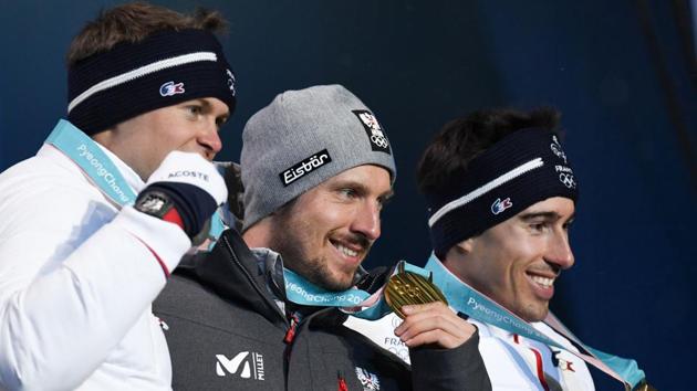 (L-R) France's silver medallist Alexis Pinturault, Austria's gold medallist Marcel Hirscher and France's bronze medallist Victor Muffat-Jeandet pose on the podium during the medal ceremony for the Men's alpine skiing combined at the Pyeongchang Medals Plaza during the Pyeongchang 2018 Winter Olympic Games in Pyeongchang on February 13, 2018. (AFP) (L-R) France's silver medallist Alexis Pinturault, Austria's gold medallist Marcel Hirscher and France's bronze medallist Victor Muffat-Jeandet pose on the podium during the medal ceremony for the Men's alpine skiing combined at the Pyeongchang Medals Plaza during the Pyeongchang 2018 Winter Olympic Games in Pyeongchang on February 13, 2018. (AFP)