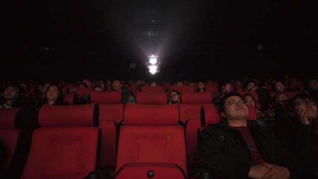 Moviegoers and journalists watch a film at a cinema in Beijing. (AP File Photo) Moviegoers and journalists watch a film at a cinema in Beijing. (AP File Photo)