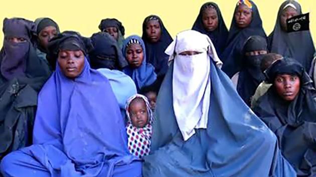 14 of the schoolgirls abducted from the northeast Nigerian town of Chibok in April 2014. (AFP File Photo/Boko Haram Handout) 14 of the schoolgirls abducted from the northeast Nigerian town of Chibok in April 2014. (AFP File Photo/Boko Haram Handout)