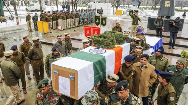 Senior officers carry the coffin of CRPF trooper Mujahid Khan, during a wreath laying ceremony on the outskirts of Srinagar. Khan was killed and a policeman injured on Monday, a few hours into the exchange that started after a guard foiled an attack on the paramilitary force’s camp situated in a densely populated area. (Waseem Andrabi / HT Photo)