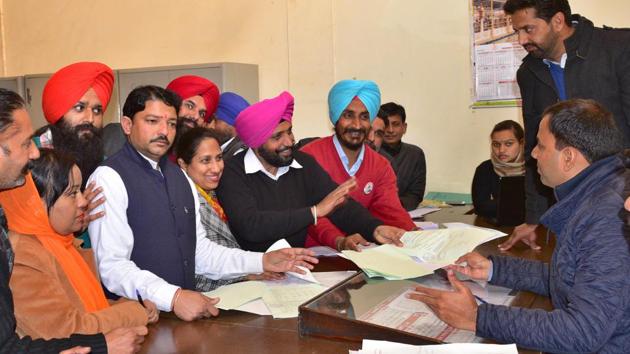 AAP leader Davinder Singh Bhola and others filing nomination papers in Ludhiana on Monday. (Gurpreet Singh/HT)
