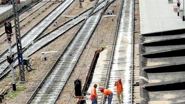 Workers check rail tracks prior to the trial run of a high-speed train between New Delhi and Agra, New Delhi railways station (File Photo)(AFP) Workers check rail tracks prior to the trial run of a high-speed train between New Delhi and Agra, New Delhi railways station (File Photo)(AFP)