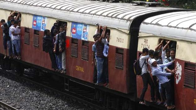 Passengers travel on the footboards of a suburban local train in Mumbai. (Kunal Patil/HT File Photo) Passengers travel on the footboards of a suburban local train in Mumbai. (Kunal Patil/HT File Photo)