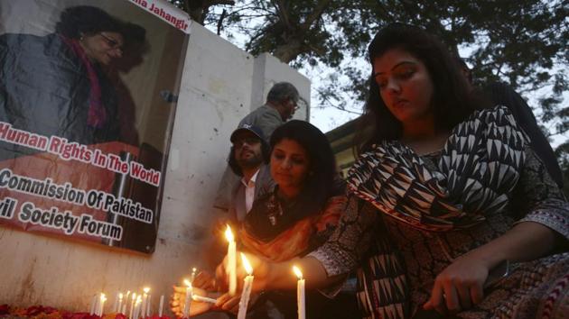 Pakistani students light candles to pay tribute to Pakistani human rights activist Asma Jehangir in Karachi on Monday. (AP) Pakistani students light candles to pay tribute to Pakistani human rights activist Asma Jehangir in Karachi on Monday. (AP)