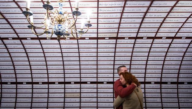 A couple hugs inside the Love Bank, part of the interactive exhibition dedicated to the longest love poem in the world, written by Andrej Sladkovic. (AFP) A couple hugs inside the Love Bank, part of the interactive exhibition dedicated to the longest love poem in the world, written by Andrej Sladkovic. (AFP)