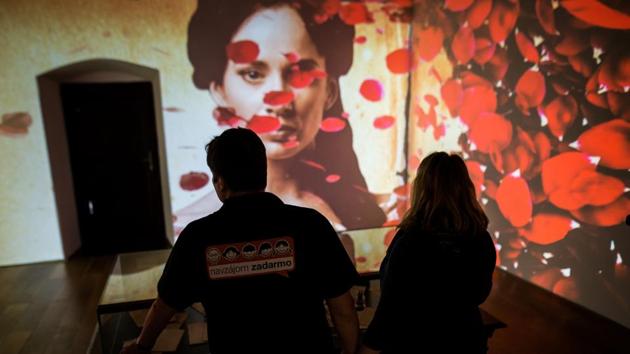 As visitors to the exhibition pass through rooms combining modern design and 500-year-old rafters, a truly Potteresque experience awaits them: four “paintings” -- large flat-screen TVs -- on the wall suddenly come alive and act out scenes from the life of the poet and Marina. (Vladimir Simicek / AFP) As visitors to the exhibition pass through rooms combining modern design and 500-year-old rafters, a truly Potteresque experience awaits them: four “paintings” -- large flat-screen TVs -- on the wall suddenly come alive and act out scenes from the life of the poet and Marina. (Vladimir Simicek / AFP)