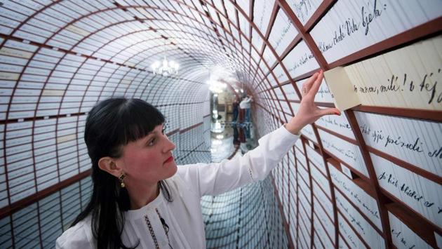 For many, it’s the “Love Bank” that attracts them here so they can store and preserve romantic mementos. A long tunnel in the basement of the house has been turned into a vault with exactly 100,000 tiny drawers, one for each letter, gap, and punctuation mark of the original, 174-year-old manuscript of “Marina”. (Vladimir Simicek / AFP) For many, it’s the “Love Bank” that attracts them here so they can store and preserve romantic mementos. A long tunnel in the basement of the house has been turned into a vault with exactly 100,000 tiny drawers, one for each letter, gap, and punctuation mark of the original, 174-year-old manuscript of “Marina”. (Vladimir Simicek / AFP)