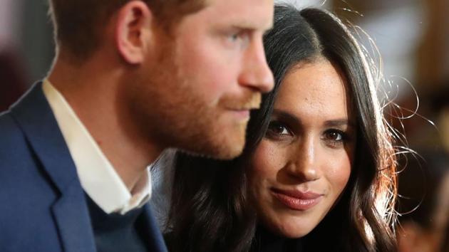 Britain's Prince Harry (L) and his fiancée actor Meghan Markle attend a reception for young people at the Palace of Holyroodhouse in Edinburgh, during their visit to Scotland on February 13, 2018. (AFP) Britain's Prince Harry (L) and his fiancée actor Meghan Markle attend a reception for young people at the Palace of Holyroodhouse in Edinburgh, during their visit to Scotland on February 13, 2018. (AFP)