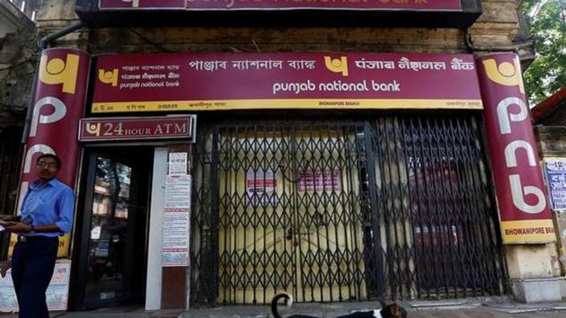 A man exits Punjab National Bank's building in Kolkata. (Reuters File Photo) A man exits Punjab National Bank's building in Kolkata. (Reuters File Photo)