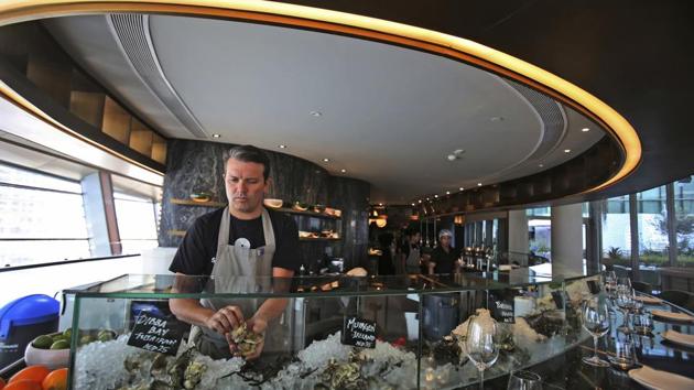 Carl Maunder, executive chef at the Maine Oyster Bar & Grill at Dubai Opera prepares an oyster dish. “Someone came to me and said: ‘Hey, have you heard of these local oysters?’ And I was like: ‘No,’” said Maunder. “It was sort of out of the blue because, this was in the summer time, it was very, very hot and just the last thing I expected anybody to be producing or farming here in Dubai.” (Kamran Jebreili / AP) Carl Maunder, executive chef at the Maine Oyster Bar & Grill at Dubai Opera prepares an oyster dish. “Someone came to me and said: ‘Hey, have you heard of these local oysters?’ And I was like: ‘No,’” said Maunder. “It was sort of out of the blue because, this was in the summer time, it was very, very hot and just the last thing I expected anybody to be producing or farming here in Dubai.” (Kamran Jebreili / AP)