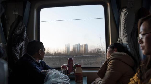 To get some breathing space in the stuffy carriages, some stood on top of seats, surveying the scene below. But few complained. Beijing authorities don’t want migrant workers to reside here in a move being called economic upgrading. Authorities say the campaign to demolish sub-standard housing, is necessary to clean the city up once and for all. (Fred Dufour / AFP) To get some breathing space in the stuffy carriages, some stood on top of seats, surveying the scene below. But few complained. Beijing authorities don’t want migrant workers to reside here in a move being called economic upgrading. Authorities say the campaign to demolish sub-standard housing, is necessary to clean the city up once and for all. (Fred Dufour / AFP)