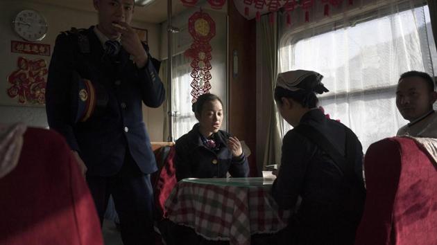 The mood in the dining car was sombre despite the cheerful red and gold decorations. Although making its periphery, migrants have kept China’s economy humming -- handling dreary, difficult and sometimes dangerous work that permanent residents shun. Industries like construction, domestic work and sanitation are almost completely staffed by migrants. Their exodus from Beijing has already slowed the city’s year-on-year growth. (Fred Dufour / AFP) The mood in the dining car was sombre despite the cheerful red and gold decorations. Although making its periphery, migrants have kept China’s economy humming -- handling dreary, difficult and sometimes dangerous work that permanent residents shun. Industries like construction, domestic work and sanitation are almost completely staffed by migrants. Their exodus from Beijing has already slowed the city’s year-on-year growth. (Fred Dufour / AFP)