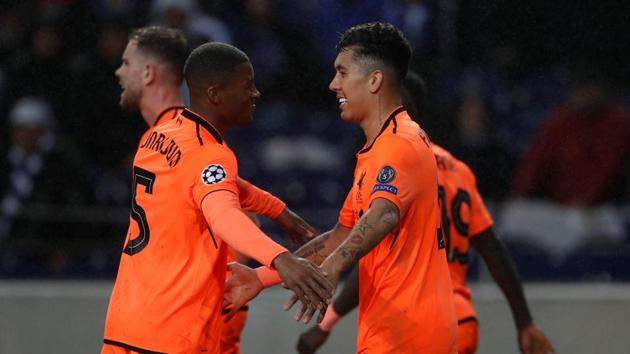 Liverpool's Roberto Firmino celebrates scoring their fourth goal against FC Porto in an UEFA Champions League round of 16 match. (Action Images via Reuters) Liverpool's Roberto Firmino celebrates scoring their fourth goal against FC Porto in an UEFA Champions League round of 16 match. (Action Images via Reuters)