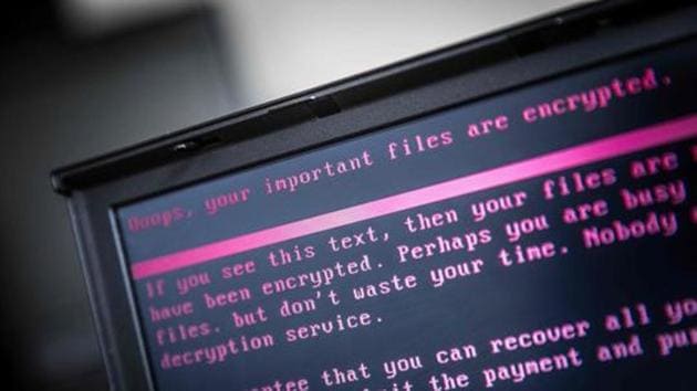 A laptop displays a message after being infected by a malware as part of a worldwide cyberattack on June 27, 2017 in Geldrop.(AFP Photo)