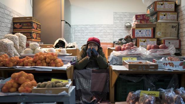 A woman selling fruits waits for customers at the street market in Gangneung, South Korea. While the Winter Olympics unfold in the nearby mountains with hordes of international athletes competing in high-stakes events, closer to the coast, life maintains its laid-back pace evident in this street market. (AP) A woman selling fruits waits for customers at the street market in Gangneung, South Korea. While the Winter Olympics unfold in the nearby mountains with hordes of international athletes competing in high-stakes events, closer to the coast, life maintains its laid-back pace evident in this street market. (AP)