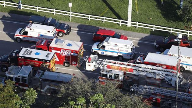 Fire Rescue personnel work the scene at the Marjory Stoneman Douglas High School. The assailant was identified as Nikolas Cruz, who was expelled a year ago for disciplinary problems. Investigators said he carried an AR-15, a semi-automatic rifle and multiple magazines. (Joe Raedle / Getty Images / AFP) 