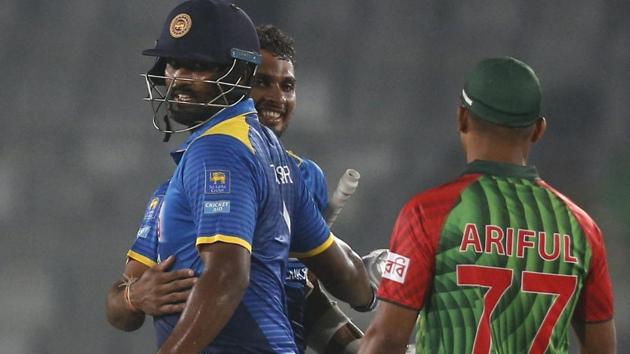 Sri Lanka cricket team’s Dasun Shanaka (left) and Thisara Perera celebrate beating Bangladesh cricket team in the first T20 match in Dhaka on Thursday.(AP)