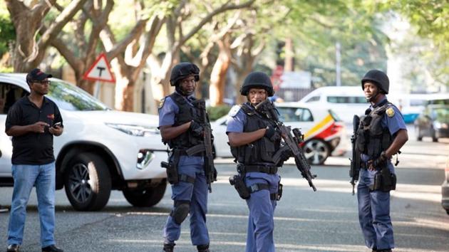 Police close off roads around the house of the Gupta family, friends of President Jacob Zuma, in Johannesburg, South Africa, on Wednesday. (Reuters file photo) Police close off roads around the house of the Gupta family, friends of President Jacob Zuma, in Johannesburg, South Africa, on Wednesday. (Reuters file photo)