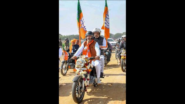 BJP President Amit Shah rides pillion with Haryana BJP President Subhash Barala on a motorcycle during the party's Yuva Hunkar rally in Jind on February 15. (PTI) BJP President Amit Shah rides pillion with Haryana BJP President Subhash Barala on a motorcycle during the party's Yuva Hunkar rally in Jind on February 15. (PTI)