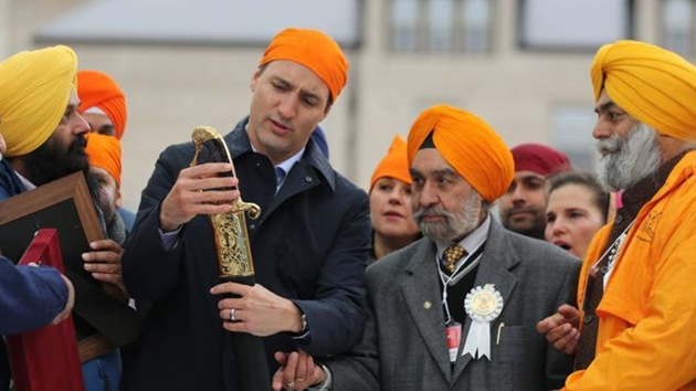 Justin Trudeau holds a ceremonial sword as he attends the Khalsa Day celebrations in front of city hall in Toronto in May last year. (Reuters) Justin Trudeau holds a ceremonial sword as he attends the Khalsa Day celebrations in front of city hall in Toronto in May last year. (Reuters)
