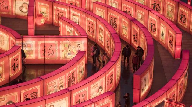 Chinese people walk in a maze at the Tang Paradise Park in Xi'an, Shaanxi province. (Fred Dufour / AFP) Chinese people walk in a maze at the Tang Paradise Park in Xi'an, Shaanxi province. (Fred Dufour / AFP)