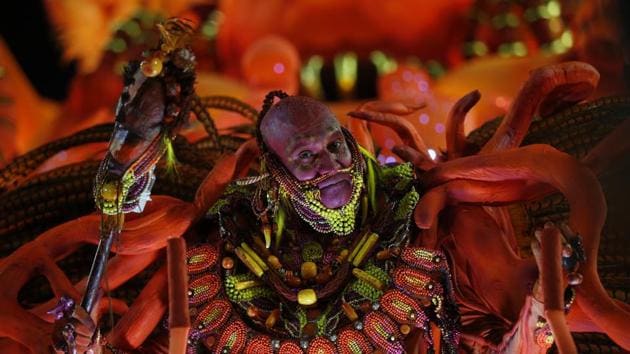A performer from the Salgueiro samba school parades during Carnival celebrations at the Sambadrome in Rio de Janeiro, Brazil. (Silvia Izquierdo / AP) A performer from the Salgueiro samba school parades during Carnival celebrations at the Sambadrome in Rio de Janeiro, Brazil. (Silvia Izquierdo / AP)