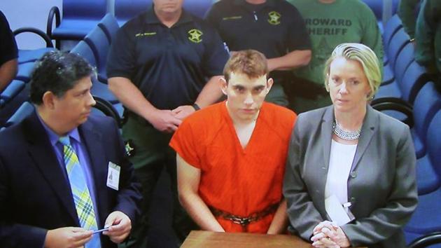 Nikolas Cruz (C) appears via video monitor with Melisa McNeill (R), his public defender, at a bond court hearing after being charged with 17 counts of premeditated murder, in Fort Lauderdale, Florida, US, on Thursday. (Reuters Photo) Nikolas Cruz (C) appears via video monitor with Melisa McNeill (R), his public defender, at a bond court hearing after being charged with 17 counts of premeditated murder, in Fort Lauderdale, Florida, US, on Thursday. (Reuters Photo)