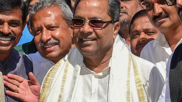 Karnataka chief minister Siddaramaiah arrives at Vidhana Soudha to present the state budget in Bengaluru on Friday.(PTI)