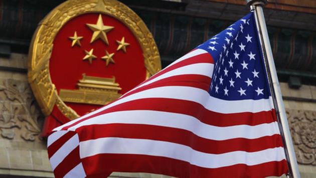 An American flag is flown next to the Chinese national emblem ahead of US President Donald Trump’s visit to Beijing. (AP File Photo) An American flag is flown next to the Chinese national emblem ahead of US President Donald Trump’s visit to Beijing. (AP File Photo)