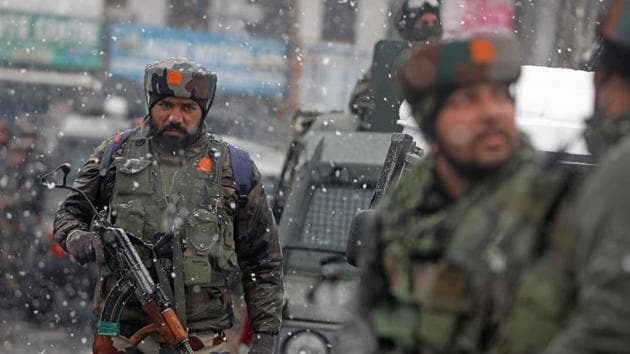 Army personnel take position during an encounter with militants, who were sheltered in a building near the CRPF camp at Karan Nagar, in Srinagar on February 12. (Waseem Andrabi / HT Photo) Army personnel take position during an encounter with militants, who were sheltered in a building near the CRPF camp at Karan Nagar, in Srinagar on February 12. (Waseem Andrabi / HT Photo)