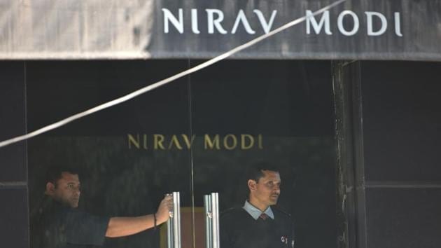 A security guard stands guard inside a Nirav Modi showroom during a raid by Enforcement Directorate in New Delhi. (Sanchit Khanna / HT Photo) A security guard stands guard inside a Nirav Modi showroom during a raid by Enforcement Directorate in New Delhi. (Sanchit Khanna / HT Photo)