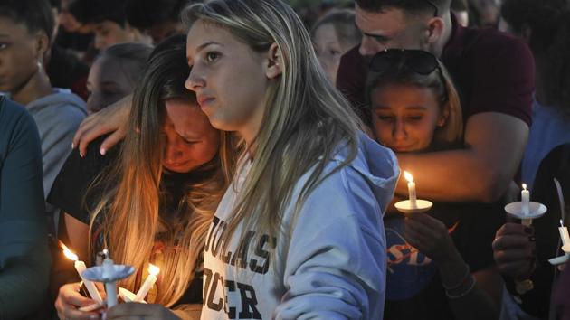 Mourners gather at a vigil that was held for the victims of the shooting at Marjory Stoneman Douglas High School in Parkland, Florida. (AP Photo) Mourners gather at a vigil that was held for the victims of the shooting at Marjory Stoneman Douglas High School in Parkland, Florida. (AP Photo)