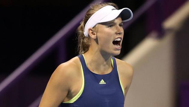 Caroline Wozniacki of Denmark reacts after winning a point from Monica Niculescu of Romania (unseen) while competing in the round of 16 during the Qatar Open tennis competition in Doha on Thursday. (AFP) Caroline Wozniacki of Denmark reacts after winning a point from Monica Niculescu of Romania (unseen) while competing in the round of 16 during the Qatar Open tennis competition in Doha on Thursday. (AFP)